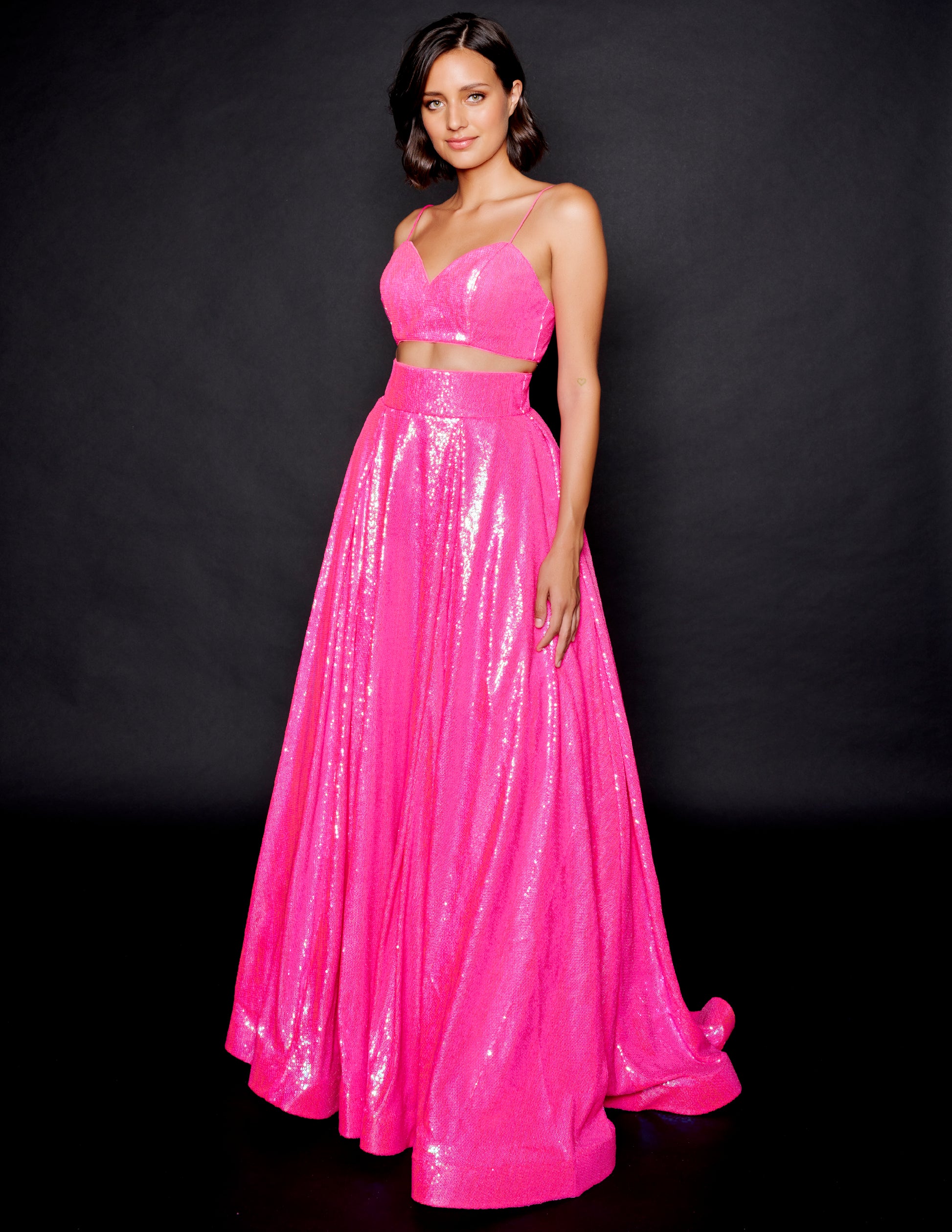 Nina Canacci 1542 Fuchsia Prom Dress  This is a two piece prom ballgown with sweetheart neckline with spaghetti straps on the cropped top.  It has a high waisted floor length A Line skirt with a wide waistband.