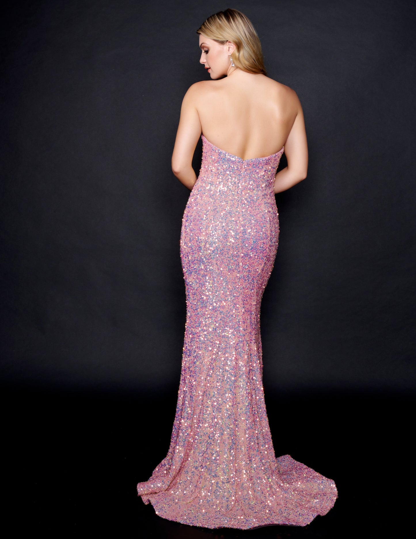Nina Canacci 3204 Rose Gold Prom & Pageant Dress and Formal Evening Gown.  This beautiful dress is a true Rose Gold.  It has a strapless bodice with a sweetheart neckline.  It is fitted and long and covered with multi colored sequins. This gown has a sweeping train.  Color:  Rose Gold