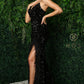 Nox Anabel R1059 Long Prom Dress.  This is an amazing evening gown made of stretch velvet sequins with a v neckline and cutout corset back.  What makes this dress so special is the slit is trimmed with feathers.  Knock them out at your next formal event.   Available colors:  Black, Royal, White