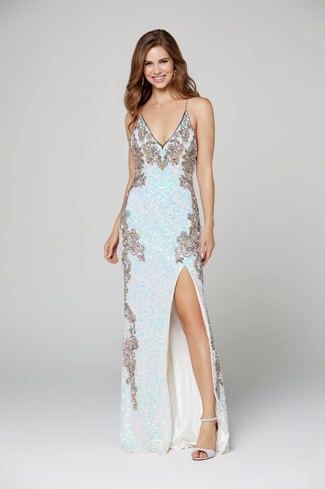 Primavera Couture 3211 is a Long sequin Embellished Evening Gown Formal Dress  Available Colors: Midnight Multi,  Platinum Multi, Red, Black, Charcoal, Ivory   Fully beaded prom dress with floral pattern and side slit. Long Sequin Gown featuring a v neckline. slit in the fitted skirt.