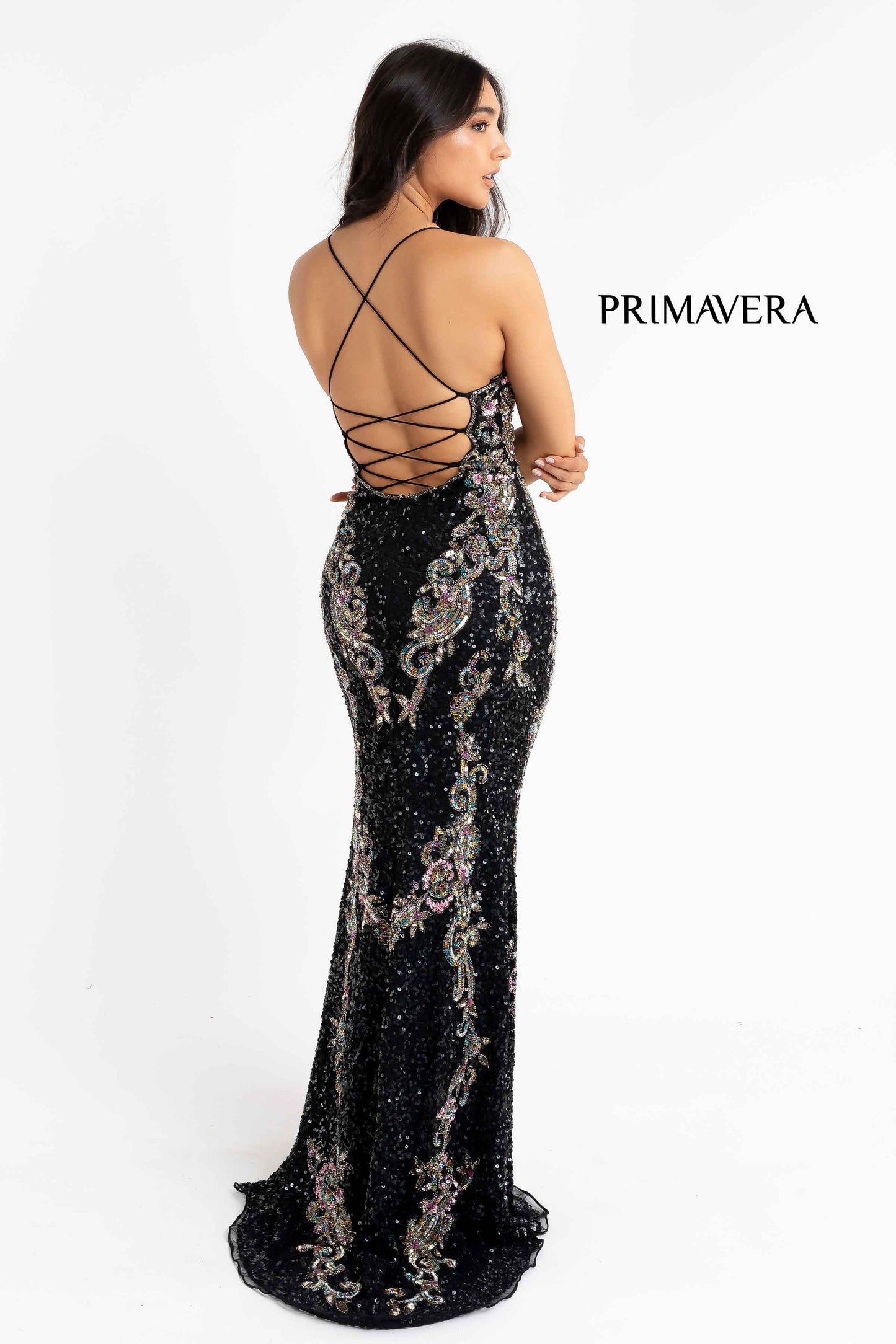Primavera Couture 3211 black s a Long fitted sequin Embellished Formal Evening Gown. This Prom Dress Features a deep V Neck with an open Corset lace up back. Beaded & embellished elegant scroll pattern accentuate curves. Fully beaded prom dress with floral pattern and side slit. Long Sequin Gown featuring a v neckline. slit in the fitted skirt, Slit in Thigh. Stunning Pageant Dress, Prom Gown & More!