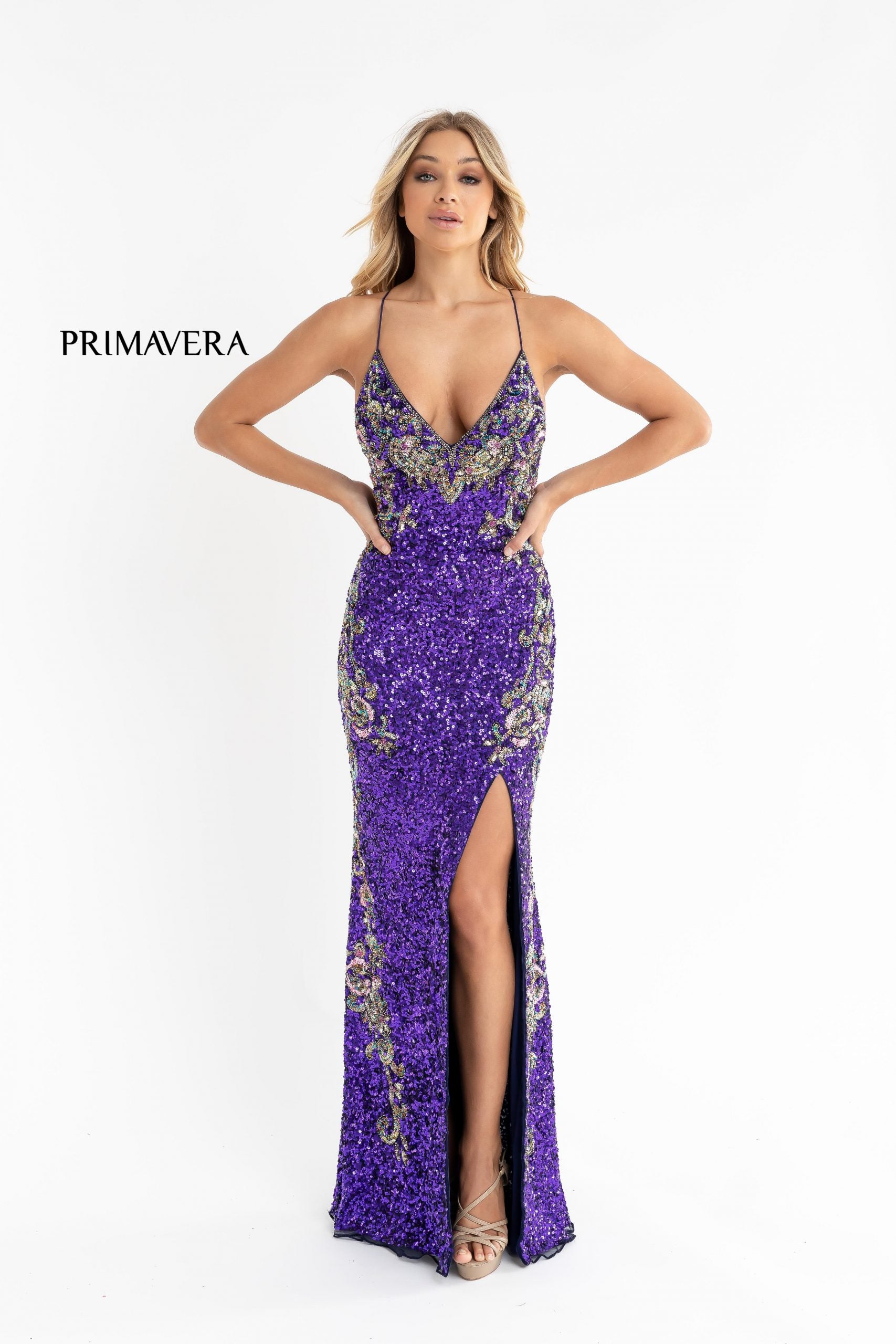 Primavera Couture 3211 Purple is a Long fitted sequin Embellished Formal Evening Gown. This Prom Dress Features a deep V Neck with an open Corset lace up back. Beaded & embellished elegant scroll pattern accentuate curves. Fully beaded prom dress with floral pattern and side slit. Long Sequin Gown featuring a v neckline. slit in the fitted skirt, Slit in Thigh. Stunning Pageant Dress, Prom Gown & More! front