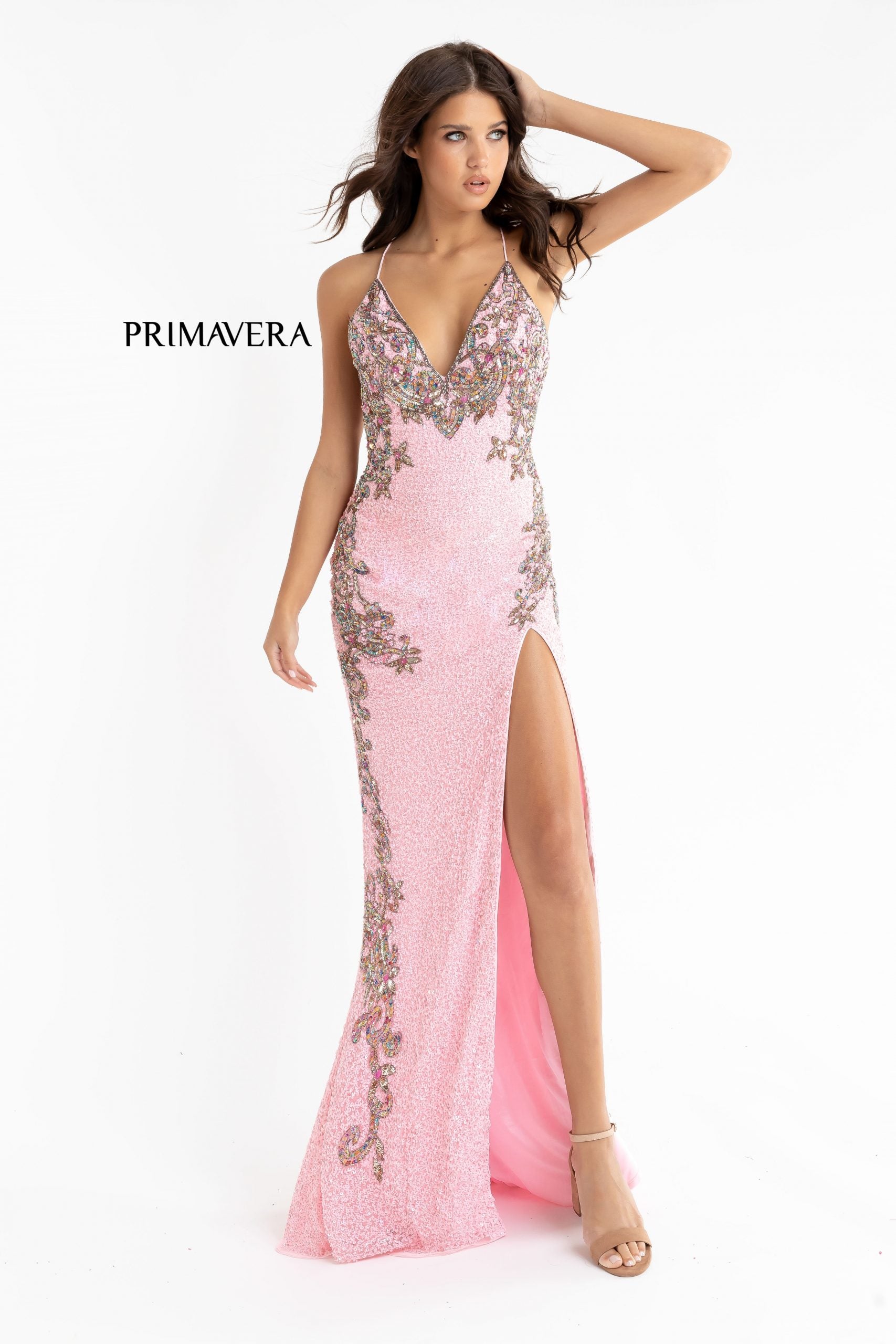 Primavera Couture 3211 baby pink is a Long fitted sequin Embellished Formal Evening Gown. This Prom Dress Features a deep V Neck with an open Corset lace up back. Beaded & embellished elegant scroll pattern accentuate curves. Fully beaded prom dress with floral pattern and side slit. Long Sequin Gown featuring a v neckline. slit in the fitted skirt, Slit in Thigh. Stunning Pageant Dress, Prom Gown & More!