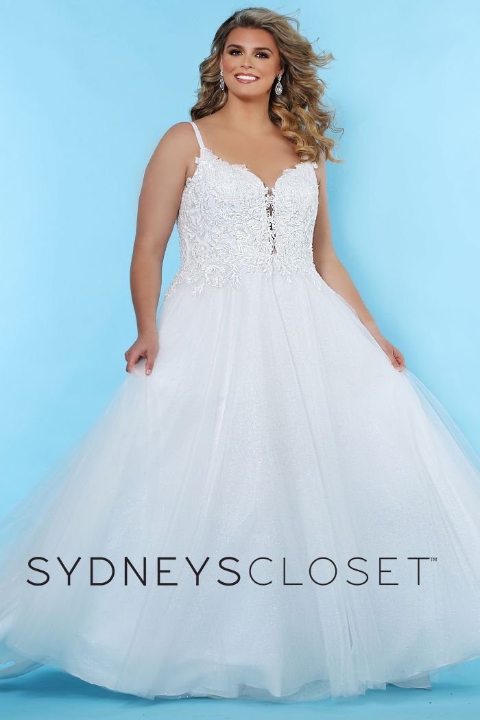 Sydney's Closet SC 5239 Josie You're a modern, fashionable bride with a nod to the traditional in this plus size lace applique wedding dress. Exquisite beaded lace bodice with V-neckline and spaghetti straps. Flattering A-line silhouette with a glitter tulle skirt.  Plunging V-neckline trimmed with lace appliques adds a hint of sex appeal. Center-back zipper and chapel train.  SC5239
