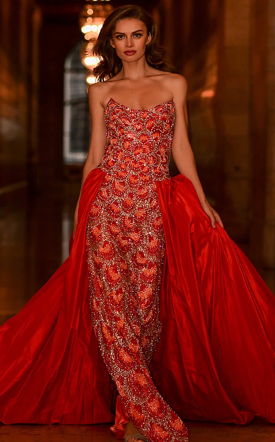Jovani S04603 is a stunning couture creation with detailed embellished bodice with a fitted silhouette and stunning chapel length gathered taffeta overskirt. slit back skirt for a classic look and ease of wear. Stunning strapless scoop neckline with peaked points for a glamorous edge. its all in the details with this formal gown! Perfect for Major Pageant or Red Carpet event!  Available Sizes: 00,0,2,4,6,8,10,12,14  Available Colors: Orange 