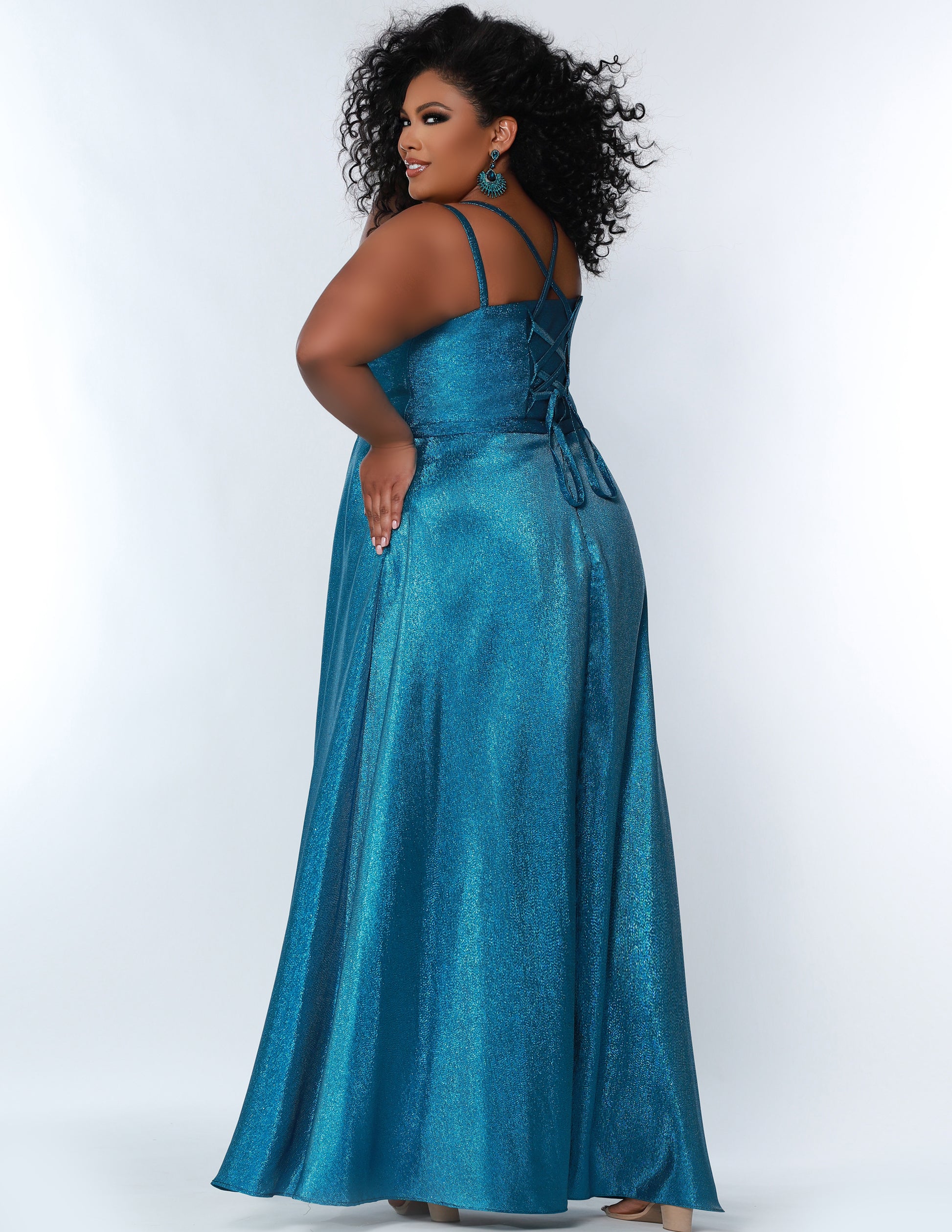 Sydney's Closet SC7344 prom dress delivers a modern and romantic look with its shimmer satin fabric, scoop neckline, A-line silhouette, and corset bodice with side slit. Perfect for making a statement on special occasions.  SC7344