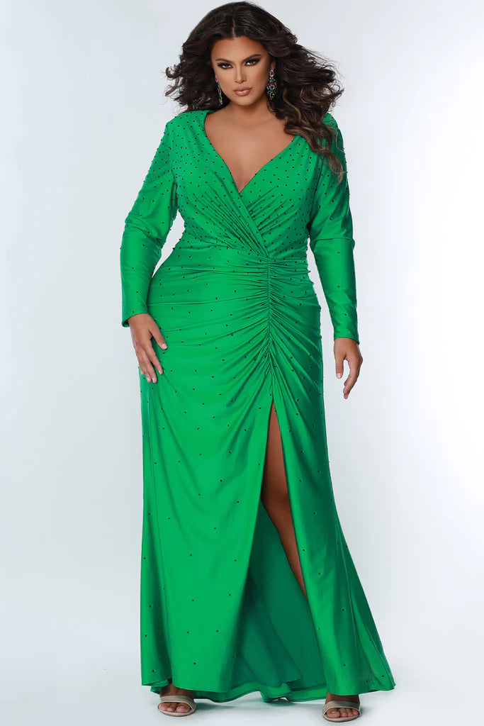 ydney's Closet SC7345 Long Sleeve Fitted Plus Size Prom Dress Slit Formal Gown V Neck Heat Stone ruched evening wear  Colors: Blue Attitude, Hot Pink, Screamin' Green Size: 14-32 Stretch lycra with hot fix stones Fitted silohuette Deep V-neckline Long sleeves High back Natural waistline with ruching Slit