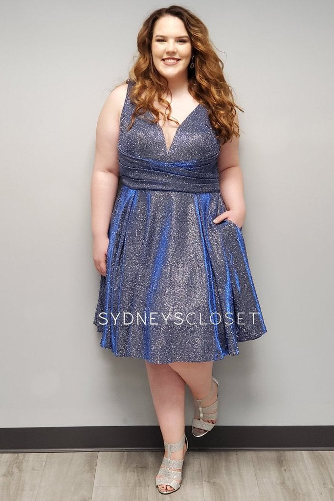 Sydney's Closet SC8108 is a short a line metallic knit shimmer formal homecoming party cocktail dress. Stretchy material adds a comfortable wear all night long. V Neckline with mesh insert and bra friendly straps. Fitted asymmetrical ruched waist. Knee length.