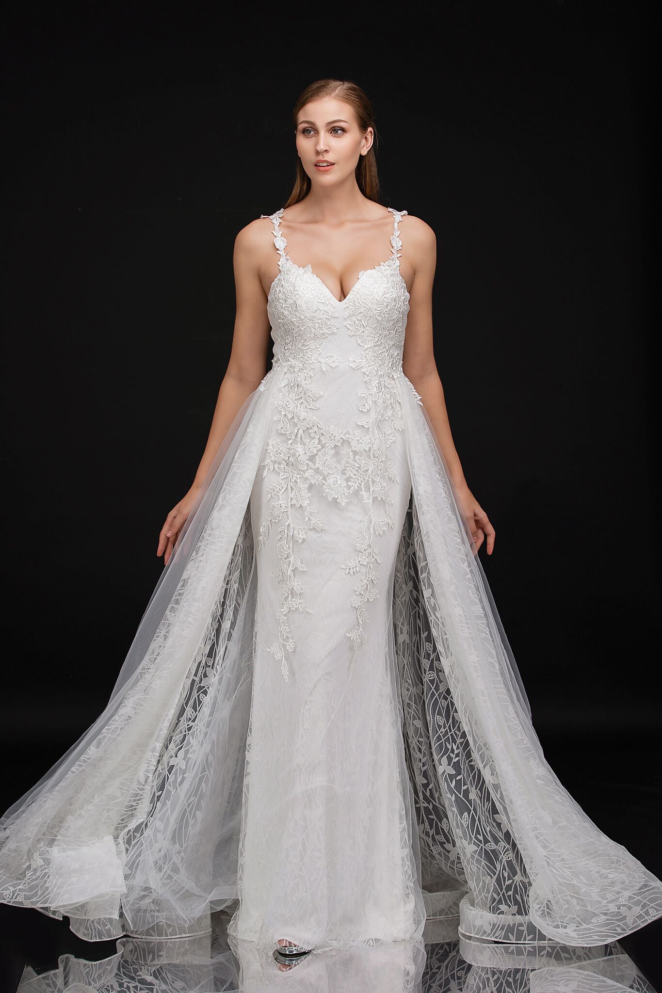 Nina Cancci 3159 is a long Lace Fitted Ivory Floral Lace Applique strap wedding dress. cracked Ice Over skirt and sweeping train. Stunning Destination Bridal Gown. Great for Plus Size! Glitter sweetheart neckline. Accented scroll pattern on the flowing overskirt. shimmering bridal gown or unique wedding dress. Sheer lace embellished straps.   Available Sizes: 8  Available Colors: Ivory/Nude