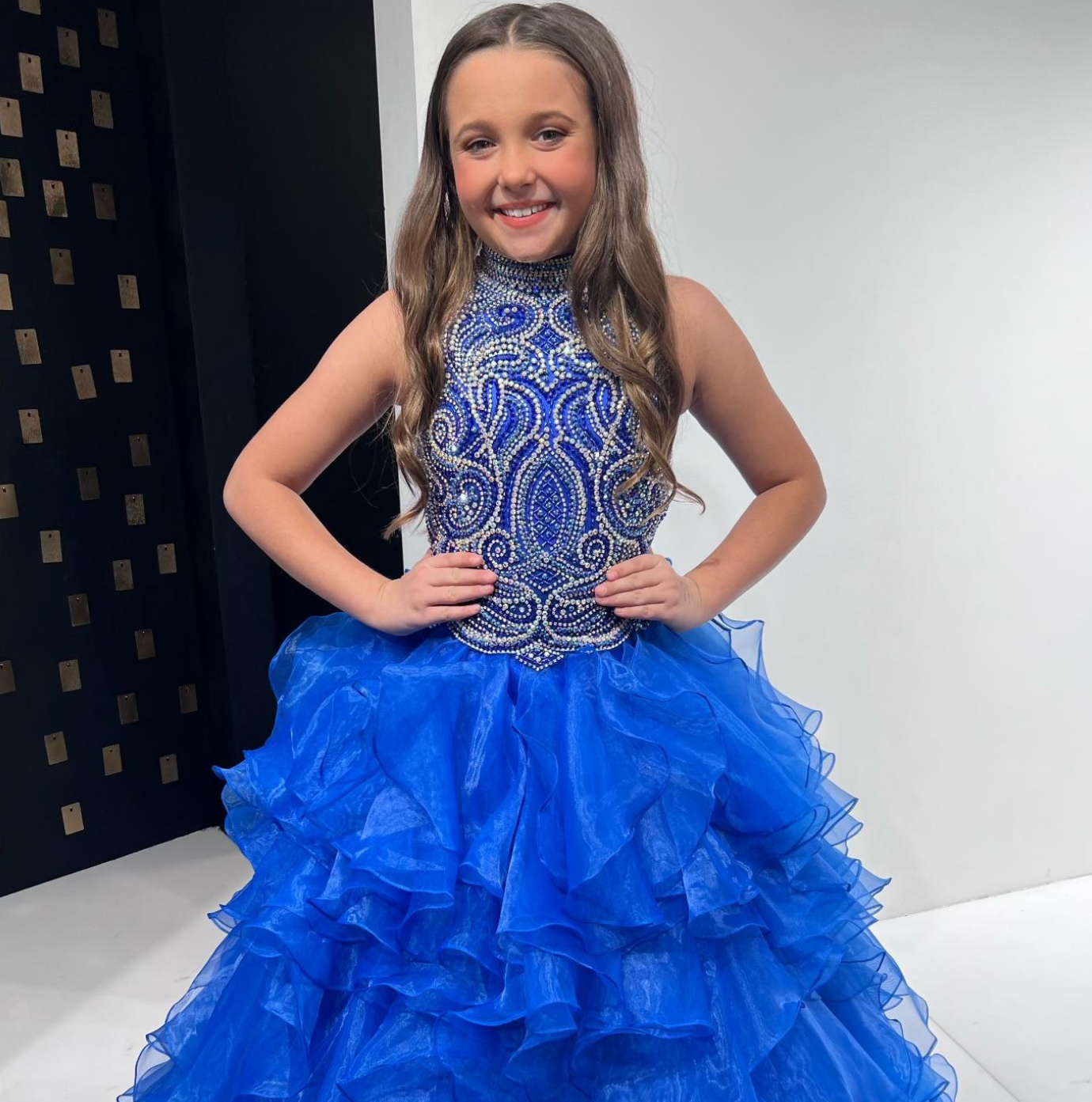 Sugar Kayne C326 is the perfect pageant dress for young girls and preteens, featuring a ruffled long skirt, high neckline, and crystal bodice with sleeveless design.  Colors:  Barbie Pink, Royal, White