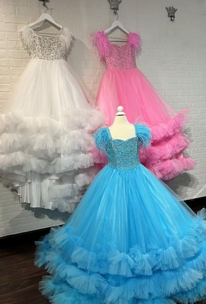 Sugar Kayne C327 features a fashionable pageant dress for girls and preteens, complete with feather straps, a tiered ruffle bottom, and a crystal stone bodice.  Colors:  Aqua, Bubblegum, White