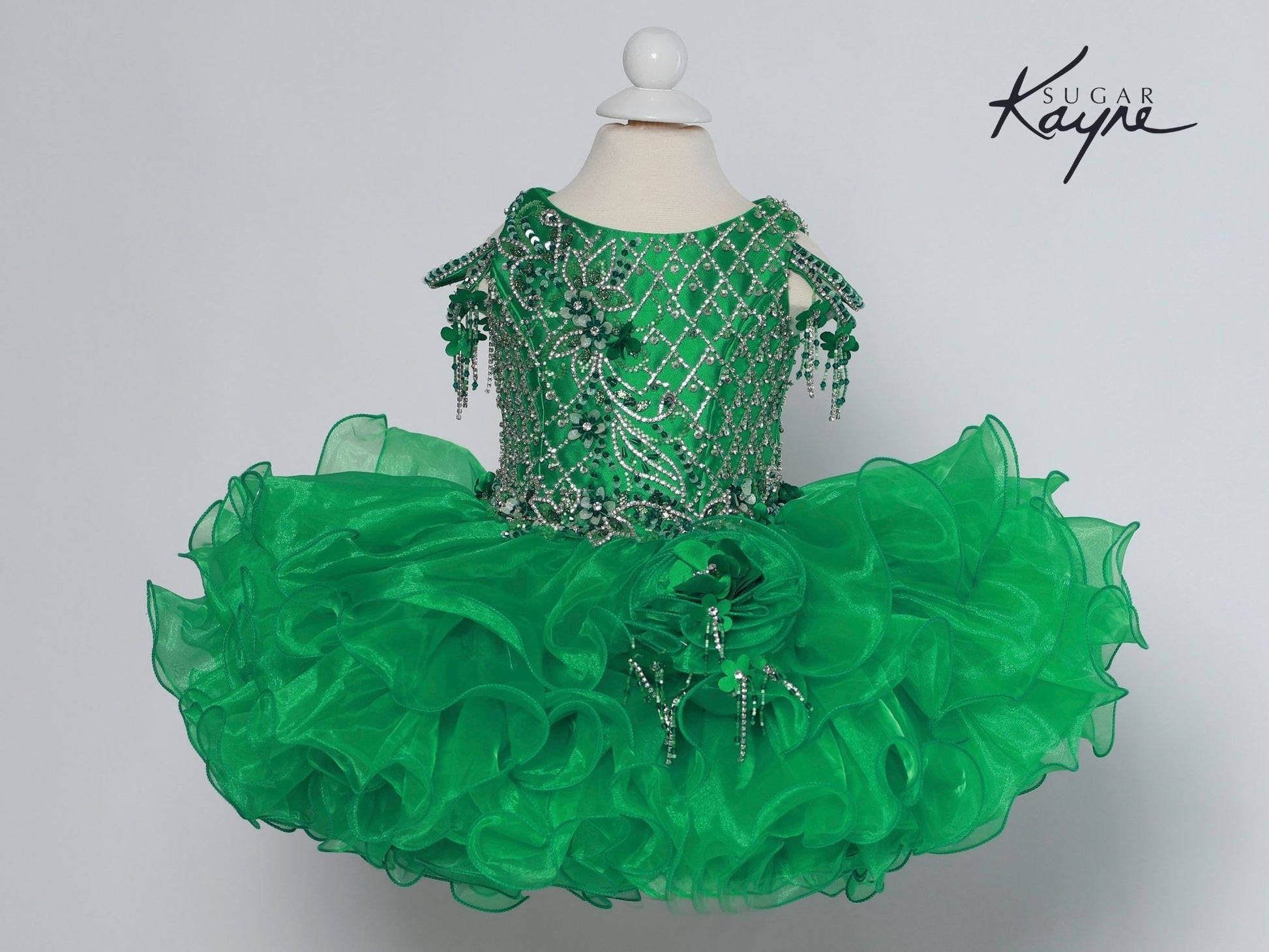 Sugar Kayne C205 Short Ruffle Girls Cupcake Pageant Dress Off the shoulder beaded fringe  Sizes: 0M, 6M, 12M, 18M, 24M, 2T, 3T, 4T, 5T, 6T  Colors: Petal Pink, Emerald, White