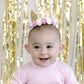 Sweet Wink -  The Gold Blush #1 Flower Crown is the perfect addition to any first birthday! This fun and festive flower crown makes a great birthday present or is an adorable way to dress up your little one for a cake smash, birthday party, or Instagram photo. Item description:  Gold glitter crown White glitter #1 Pink and ivory flowers trim the base of the crown Light pink felt lining inside the crown and on the bottom of the crown to ensure comfort and softness on the child's head Light pink elastic to se