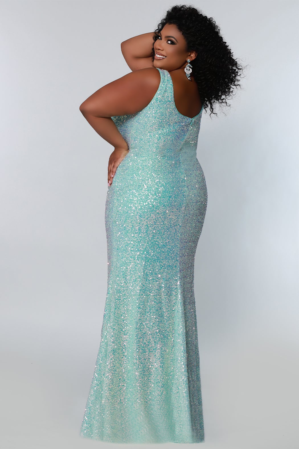 Tease Prom TE2201 Sydneys Closet Long Fitted Sequin Plus size prom dress slit  Colors: Aqua, Peach, Unicorn Size Availability: 14-28 Fitted silhouette V-neckline Pleated bodice Empire waistline Slit on right side of skirt 5 inch sweep train Bra-friendly straps Invisible zipper Scoop back Multi-dimensional sequins Stretch knit lining
