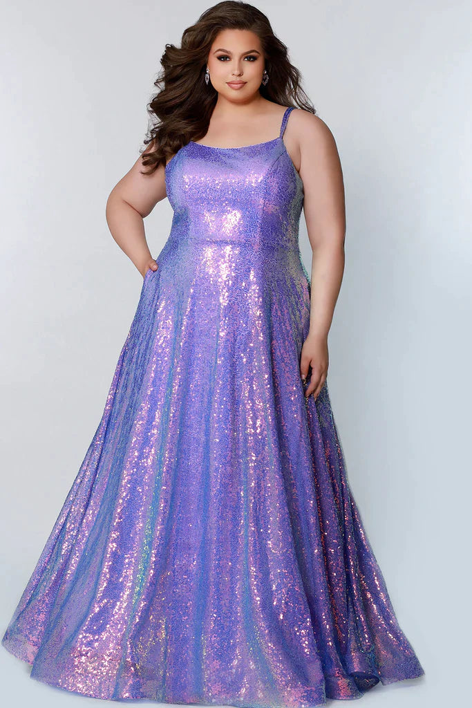 Sydney's Closet TE2208 Long Sequin A Line Plus Size Prom Dress Pockets Formal Gown  Colors: Arctic Frost, Polar Purple, Peacock Size Availability: 14-32 A-line silhouette Scoop neckline Double ½ inch straps in sequins Pockets A-line skirt Natural waist Horsehair hem Multi-dimensional sequins Stretch knit lining