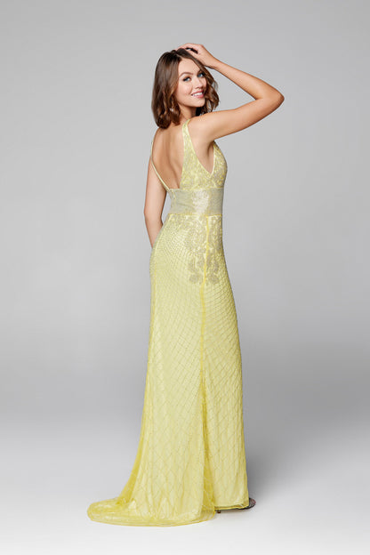 Primavera Couture 3617 is a long Fitted formal prom dress evening gown. Featuring a Fully Embellished Fitted V Neckline bodice with an open back. Wide liquid beaded waist band. floral scroll beaded details along the sides cascading down from the bodice. Slit in skirt with a sweeping train.  Available Sizes: 00,0,2,4,6,8,10,12,14,16,18  Available Colors: Black, Ivory, Lilac, Pewter, Yellow