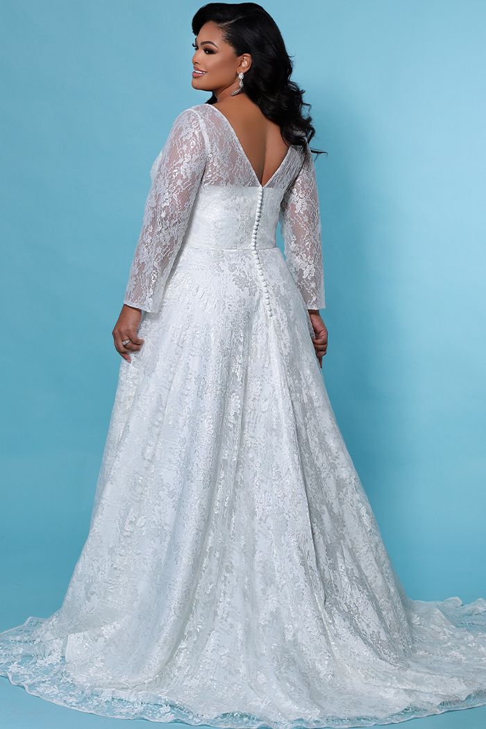 Sydney's Closet Bridal Dress Lily SC5261  Wedding Dress.    Curvy brides look breathtakingly beautiful on your wedding day when you wear this simple long sleeve, chic A-line wedding dress. Long sleeves accented with five covered buttons just above the wrist. You'll have your choice of jewelry to accent the flattering V neckline. Overall floral lace idea for formal or informal.