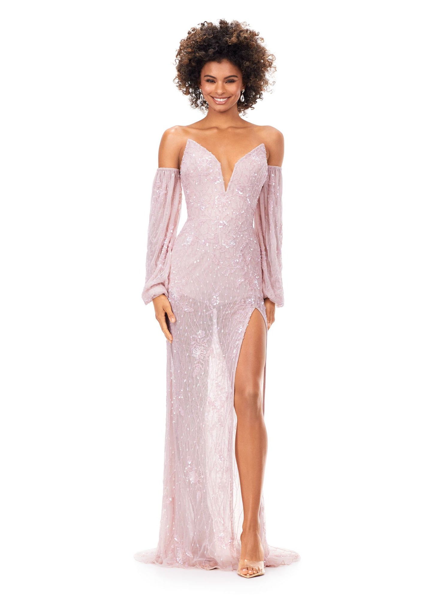 Ashley Lauren 11304 This strapless evening gown has detachable puff sleeves and is adorned with a floral hand beaded design. The dress is lined with a built in romper. The look is complete with a left leg slit. Strapless Bustier Detachable Puff Sleeves Romper Lining Left Leg Slit COLORS: Ice Pink, Ivory, Ice Blue