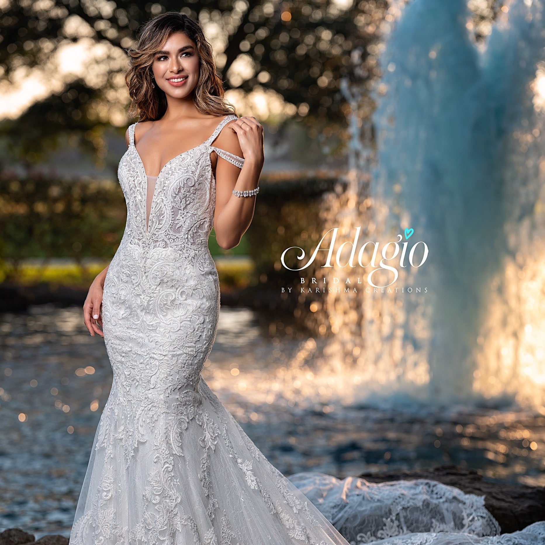 Adagio Bridal W9365 plunging v neckline mermaid embellished lace wedding dress bridal gown with train features double straps one off the shoulder to create cold shoulder effect.  Colors  Ivory  Sizes  00, 0, 2, 4, 6, 8, 10, 12, 14, 16, 18, 20, 22, 24, 26, 28, 30 
