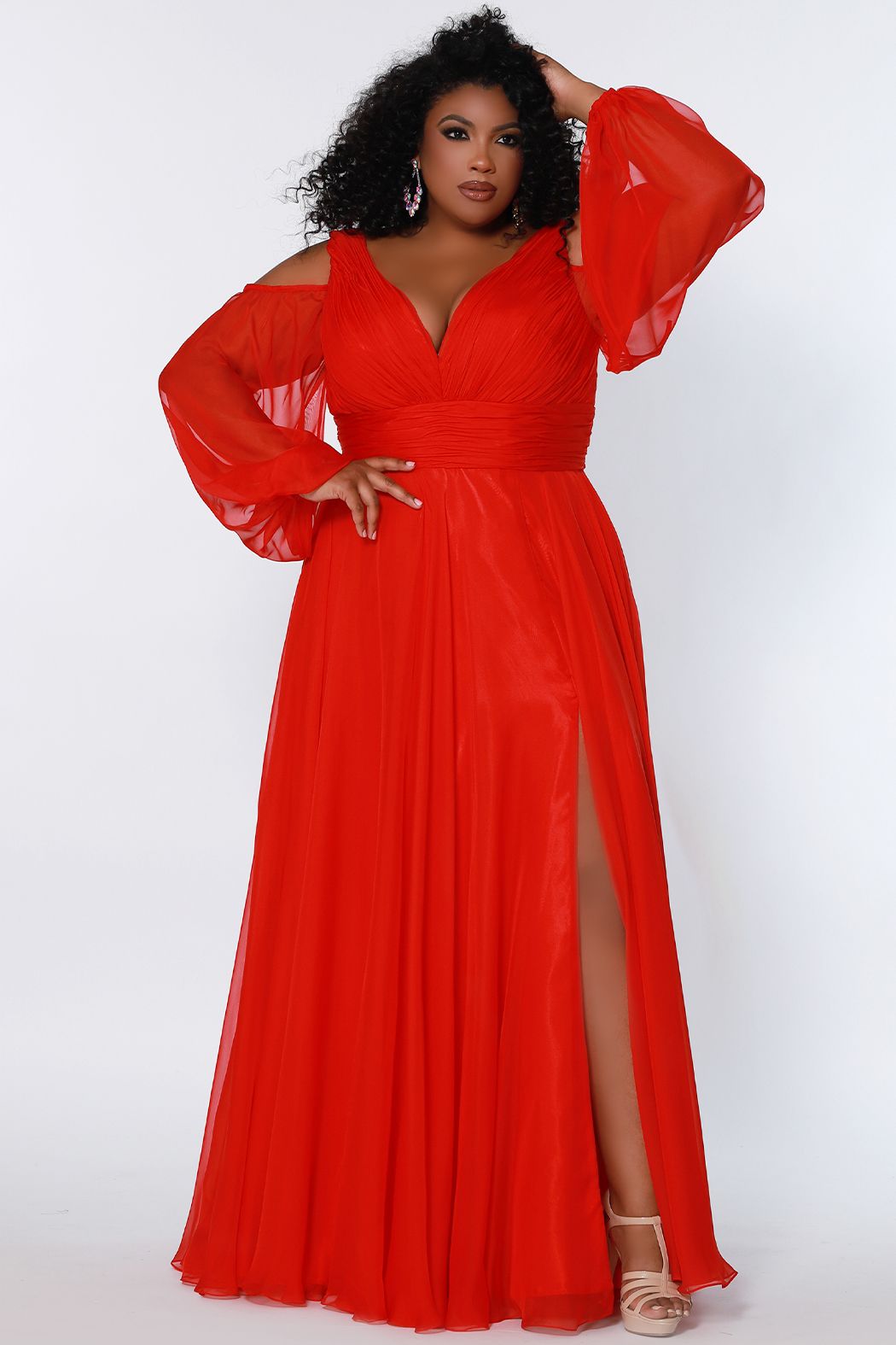 Johnathan Kayne for Sydney's Closet JK2205 A-Line Poly Chiffon Cold Shoulder Long Pouf See-Thru Sleeves Plus Size Prom Dress. Make a fashion statement in the Johnathan Kayne for Sydney's Closet JK2205 prom dress. Crafted from soft poly chiffon, this A-line silhouette features see-thru sleeves and cold shoulders for added drama. With an elegant pouf skirt, this plus size dress ensures superior comfort and absolute confidence.