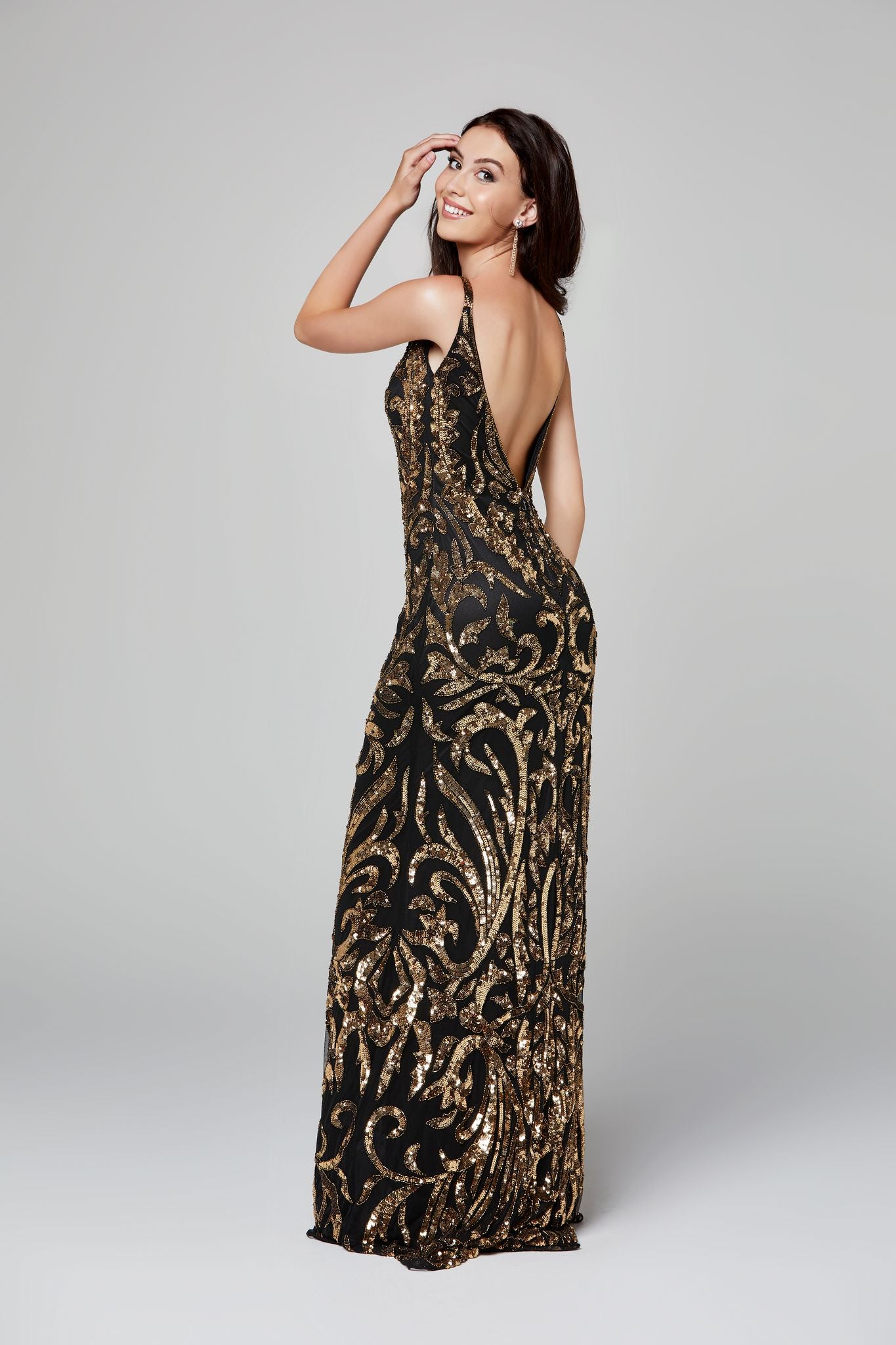 Primavera Couture 3454 is a Beaded Sequins Designer Prom, Pageant & Formal Dress. Featuring a Plunging V neckline with mesh panel. Embellished sequins & Hand beading along the entire gown in a damask print. Great evening gown. Open scoop back.  Black/Gold  size 8