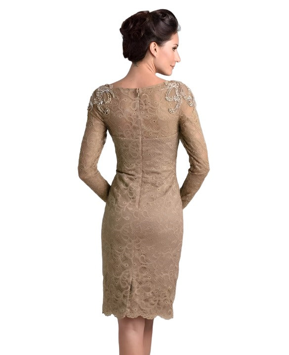 Nina Canacci M208 is a short fitted lace knee length cocktail dress. Sheer High lace neckline with long sleeves. beading, Crystal Rhinestones & Embellishments adorn the shoulder on this great mother of the bride/groom style. Available Sizes: 6, 8, 10  Available Colors: Brown