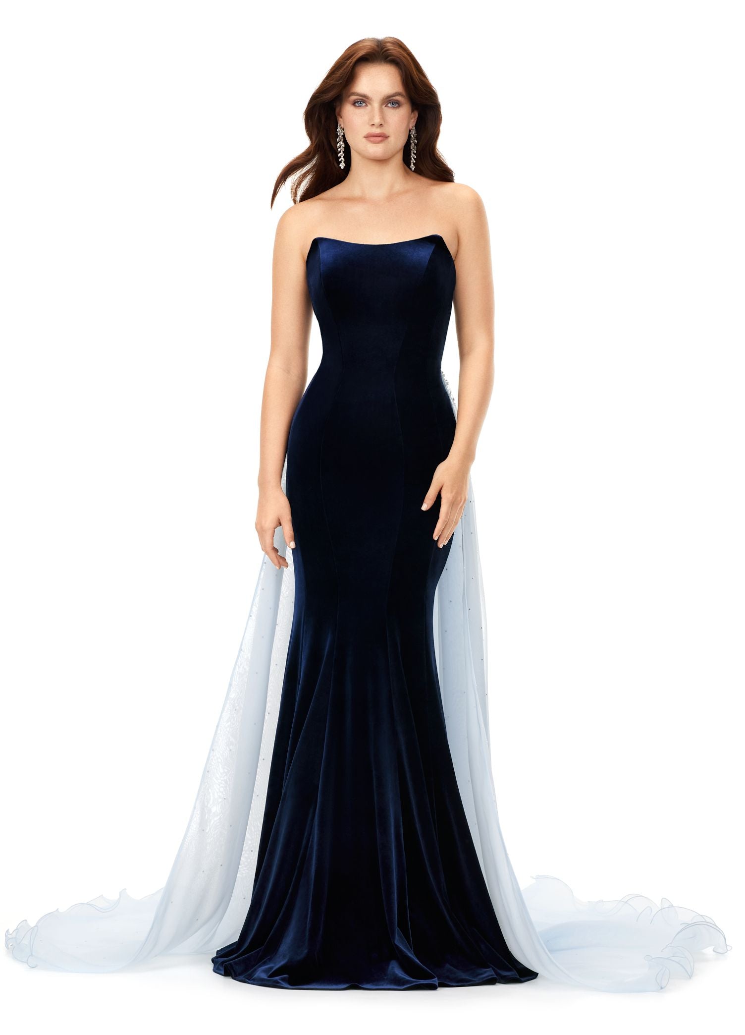 Ashley Lauren 11311 This stunning velvet gown features a sweetheart neckline with an organza overskirt. The overskirt is embellished with scattered crystals that cascade down the skirt. Strapless Bustier Crystal Details Stretch Velvet Organza Overskirt COLORS: Navy/Sky, Black/Ivory