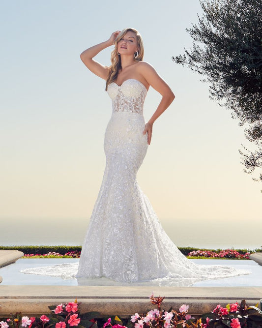 Casablanca 2448 Joceyln   Beading and lace will never go out of fashion, and Style 2448 is the perfect example of timeless beauty. This glamorous wedding dress features layers upon layers of detail, with perfecting satin, organza, and Chantilly lace sitting underneath sparkling beaded floral lace. A fit and flare silhouette accentuates the natural curves of the body, held up by a supportive strapless sweetheart neckline. A beautiful 74 inch train is the final touch for this modern wedding day look.