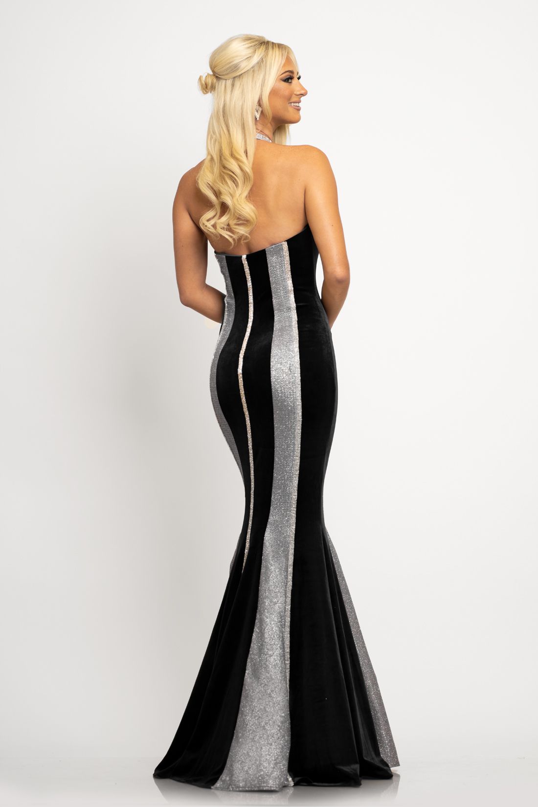 Johnathan Kayne 2268 This is a embellished collar neckline long mermaid prom dress with a mid open back.  This textured glitter pageant gown alternates with stretch velvet and features a slimming and curvy design. Make this your next pick for your evening dress. Color Black  Sizes  00, 0, 2, 4, 6, 8, 10, 12, 14, 16