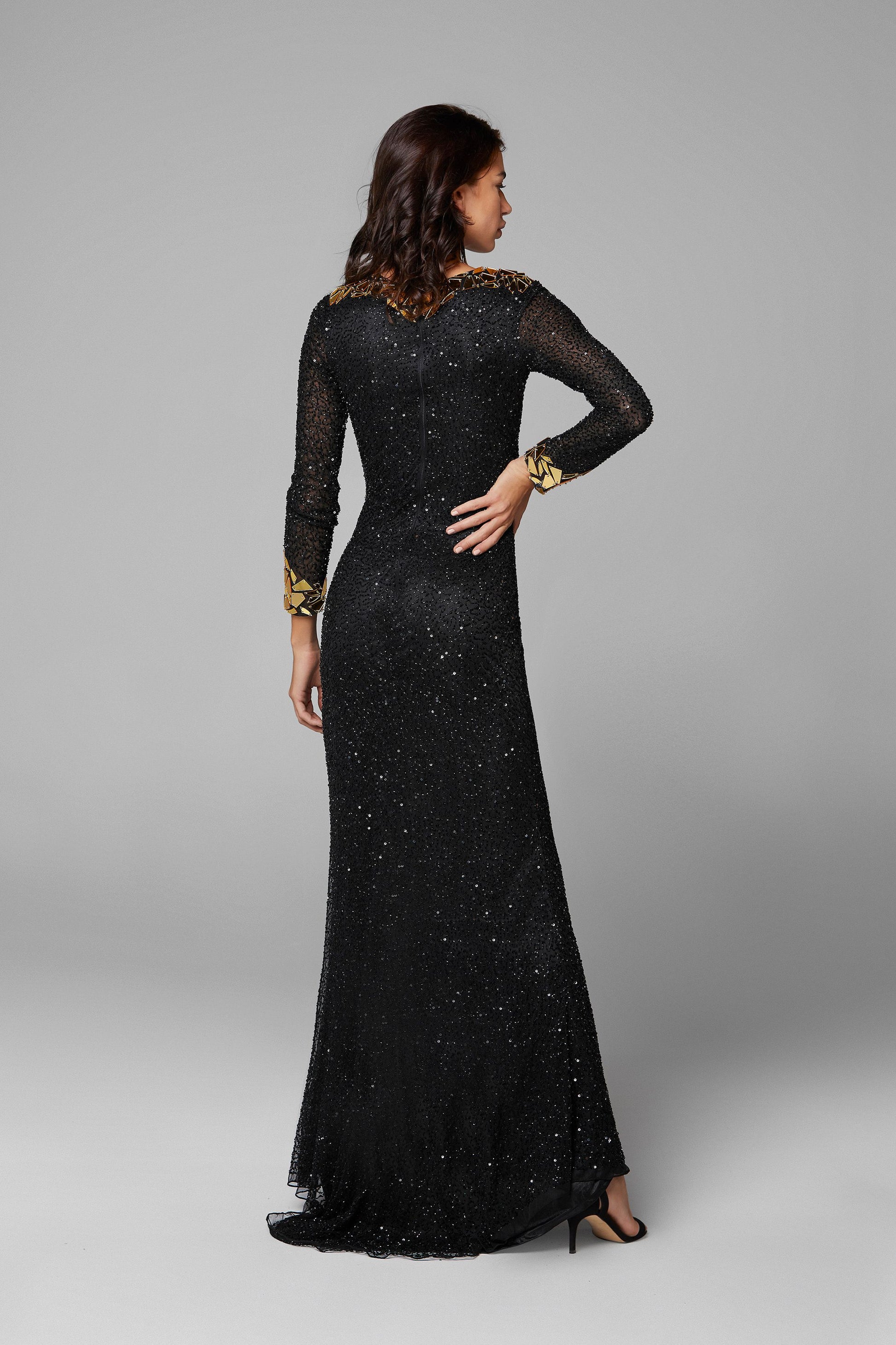 Primavera Couture 3614 is a long sleeve fitted fully Embellished formal prom dress evening gown. Featuring a high neckline and long sheer sleeves. This gown is accented with cut glass pieces around the neckline, end of sleeves & Around the slit on this stunning Prom & Pageant Gown. Sweeping train.  Available Sizes: 00,0,2,4,6,8,10,12,14,16,18,20,22,24  Available Colors: Black/Gold, Black/Multi, Ivory, Raspberry