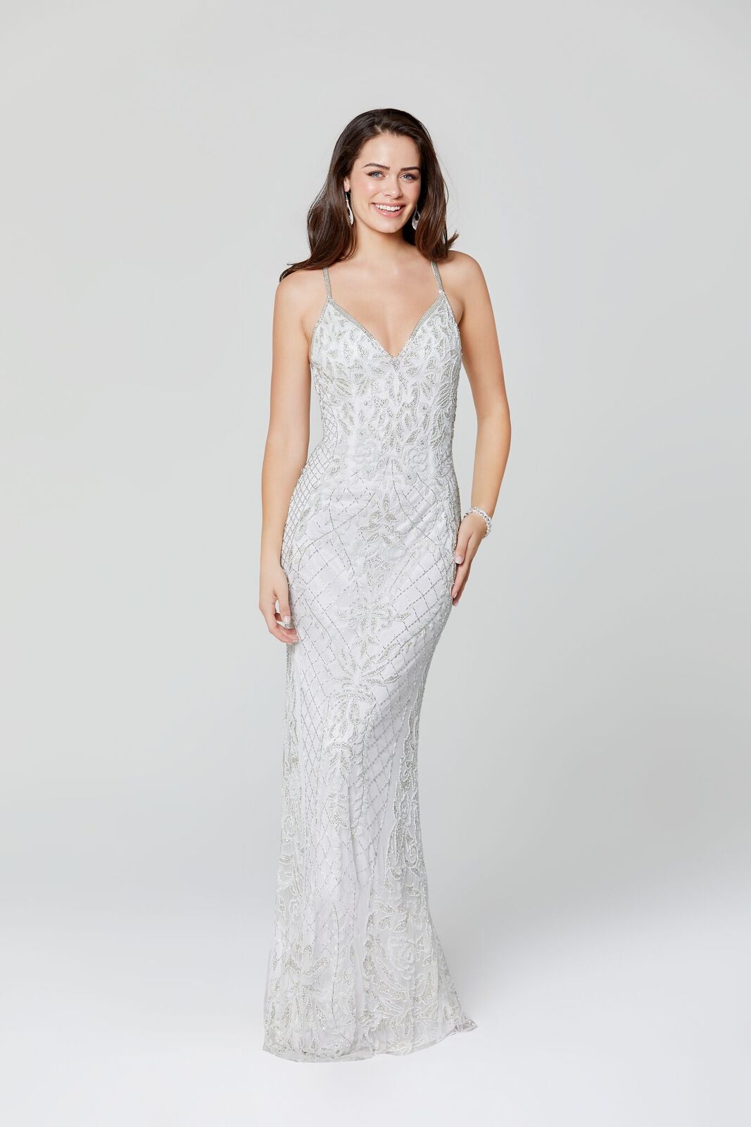 Primavera Couture 3428 is a beaded Prom Dress, Pageant Gown, Wedding Dress & Formal Evening Wear gown. This Gown Features a v neckline with spaghetti straps that criss cross in the open back full long sequin and bead skirt. 