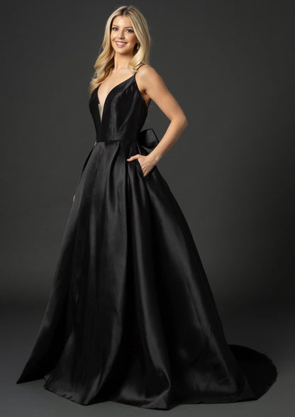 Nina Canacci B1900 This is a satin ballgown with a V neckline with sheer panel made in luxurious satin.  It can serve as a wedding dress, evening gown, prom, pageant, debutante and more.   It has double straps that lead to a full luxury bow in the lower back at the waistline and flows into a satin A line skirt   Colors:  Black  Sizes: 0