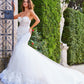 Jovani Bridal JB07260 Sheer Corset Lace Mermaid Wedding Dress Bridal Gown Train Strapless  This Jovani JB07260 off white wedding dress is styled in soft tulle with floral appliques, featuring a sheer corset bodice with a strapless sweetheart neckline. Lush godets form this trumpet-style bridal gown, finished with a lace border hemline and a semi-cathedral train.  Available Sizes: 00-24  Available Colors: Off White