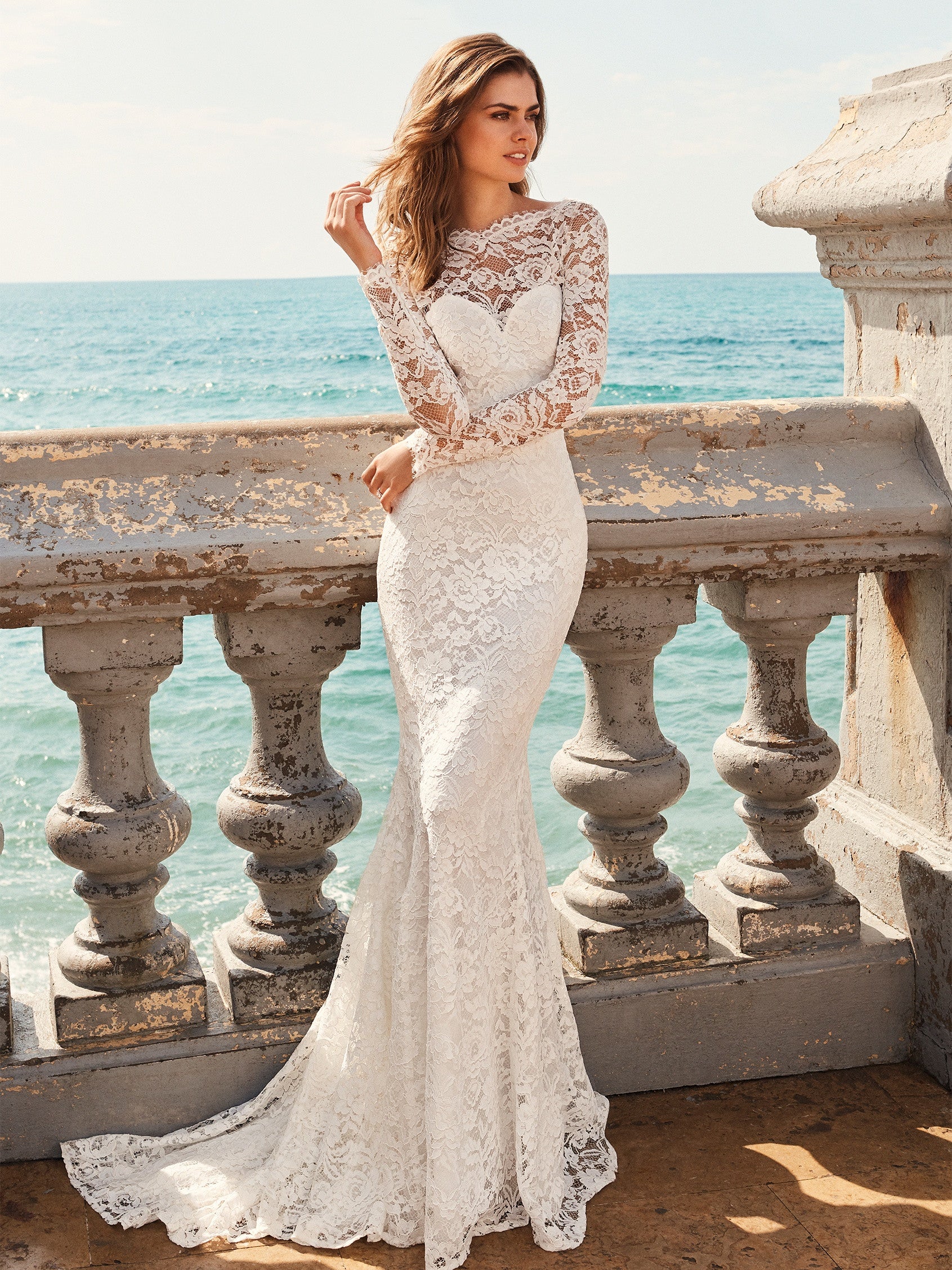 Pronovias White One Bridal JIANNA  Exquisite mermaid style wedding dress in lace. The sweetheart neckline combined with the semi-sheer tulle in the bateau neckline and long sleeves adds lots of sensuality. As does the incredible back.  IN STOCK FOR IMMEDIATE DELIVERY!  Size US 10    