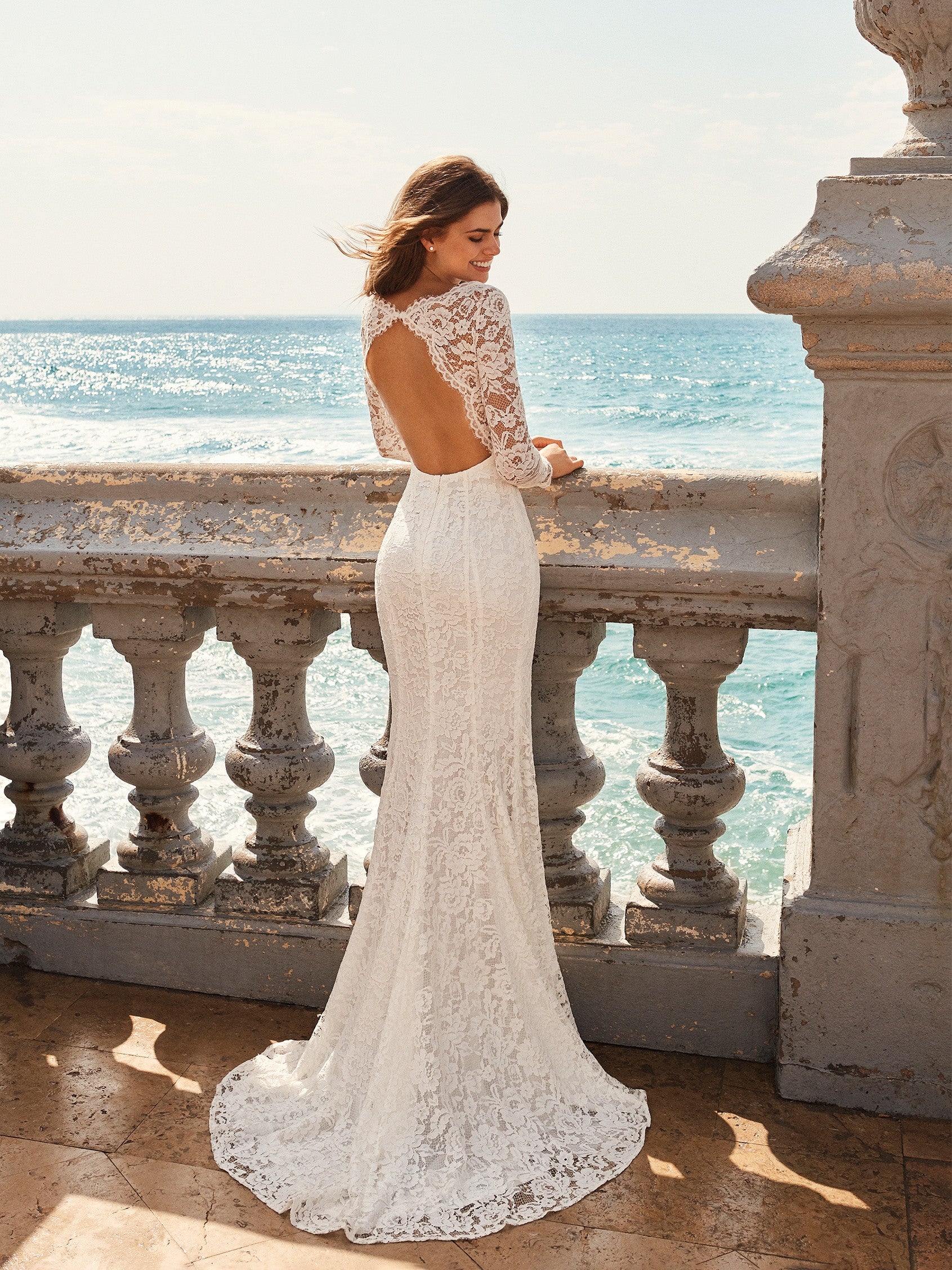 Pronovias White One Bridal JIANNA  Exquisite mermaid style wedding dress in lace. The sweetheart neckline combined with the semi-sheer tulle in the bateau neckline and long sleeves adds lots of sensuality. As does the incredible back.  IN STOCK FOR IMMEDIATE DELIVERY!  Size US 10    