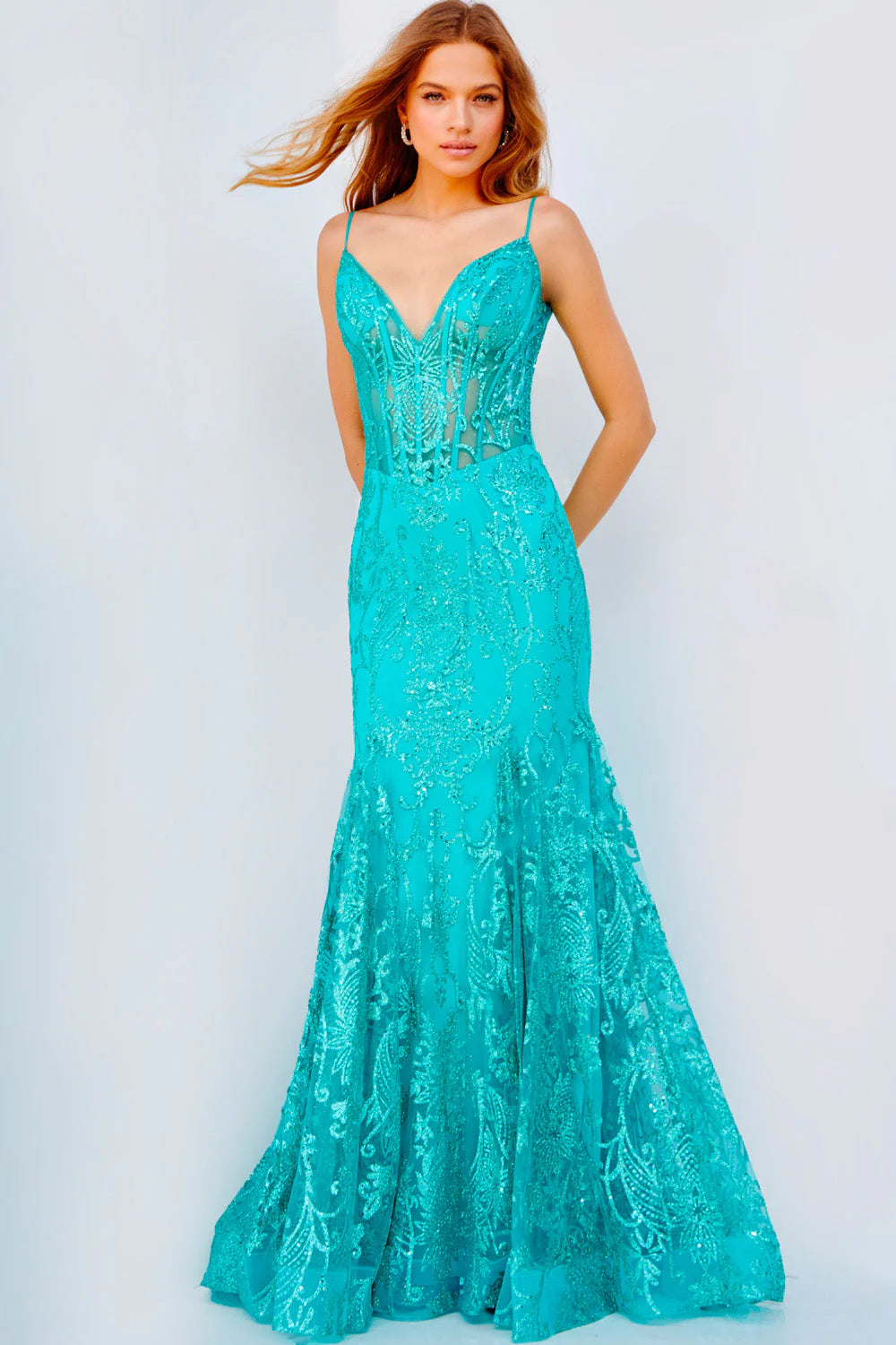 The Jovani 22388 Long Fitted Sheer Corset Mermaid Glitter Prom Dress is constructed with a fitted corset bodice, adorned with glittery accents and a mermaid silhouette. It is designed with a V-neckline, sheer fabric overlay and a long, ruched skirt. Perfect for special occasions, this formal gown will have you looking and feeling your best.  Size: 14  Color: Aqua