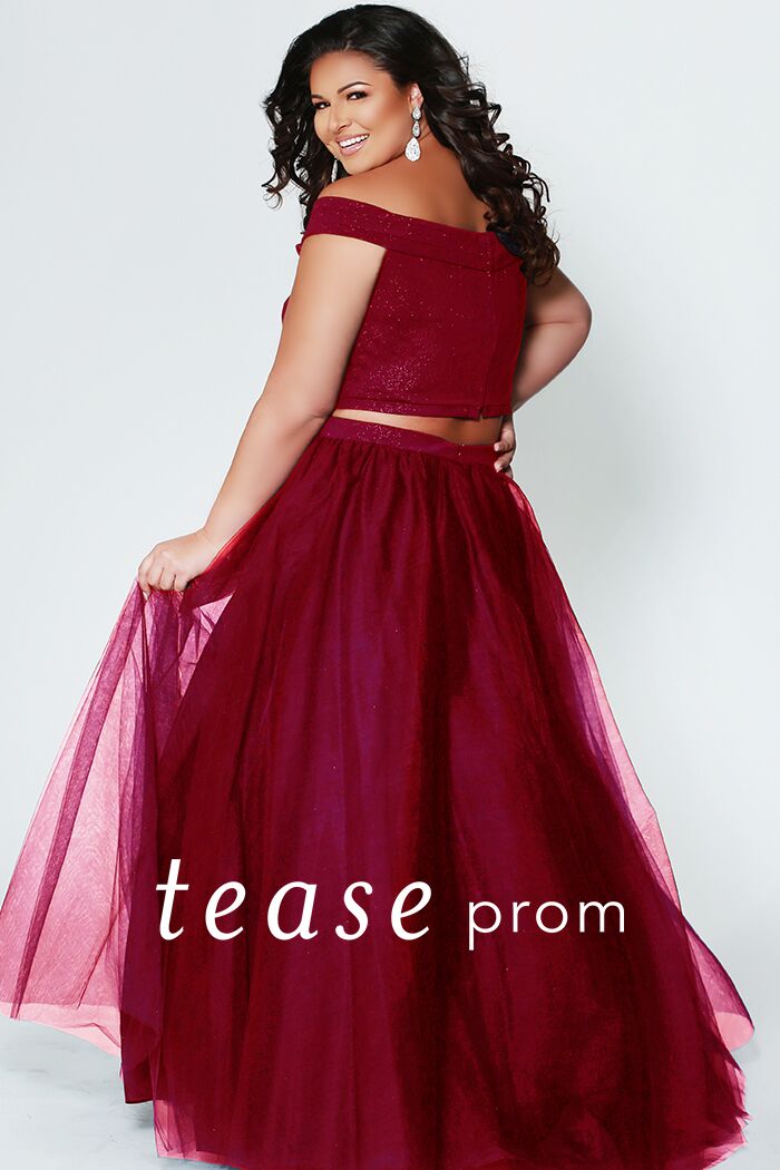 TE1909  Be a trend setter at Prom wearing a monochrome two-piece plus size dress. Sparkly red or blue off-shoulder top and tulle skirt with curly horsehair hem. Crop-top and waistband in matching light-red sparkle-embedded fabric. This dress is right on trend for prom.