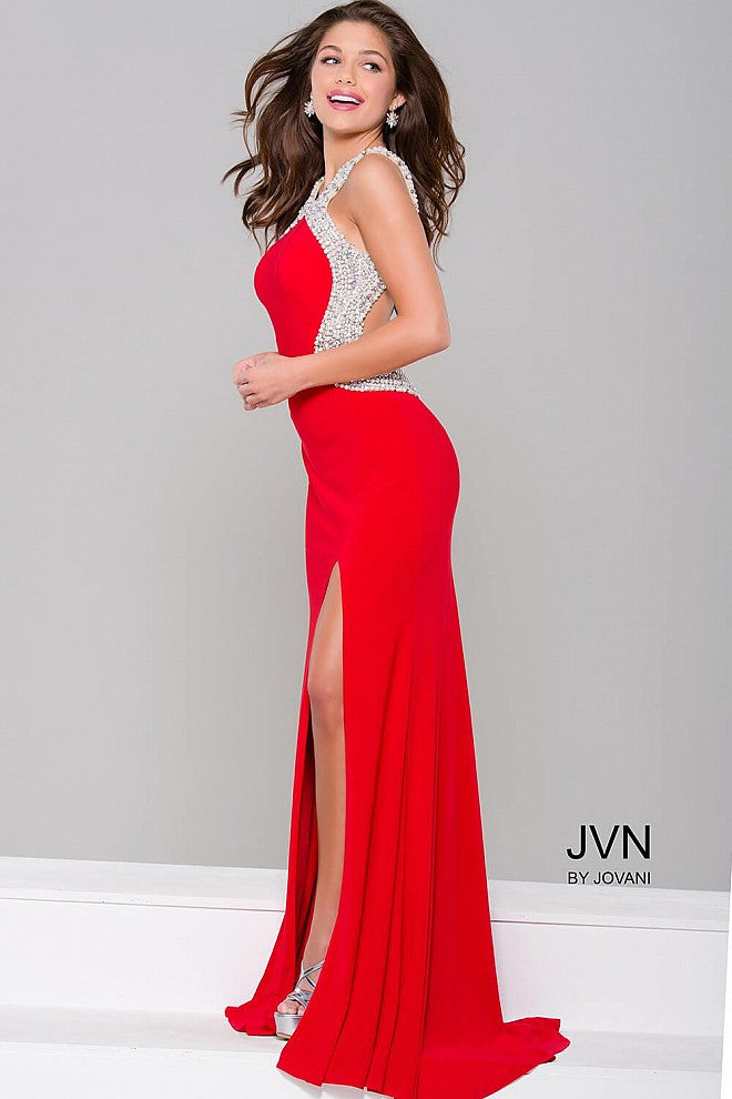 JVN47030 Elegant backless form fitting stretch jersey prom dress features a sexy thigh high slit and crystal and pearl embellishments that line the figure in an hourglass shape. Pageant gown 