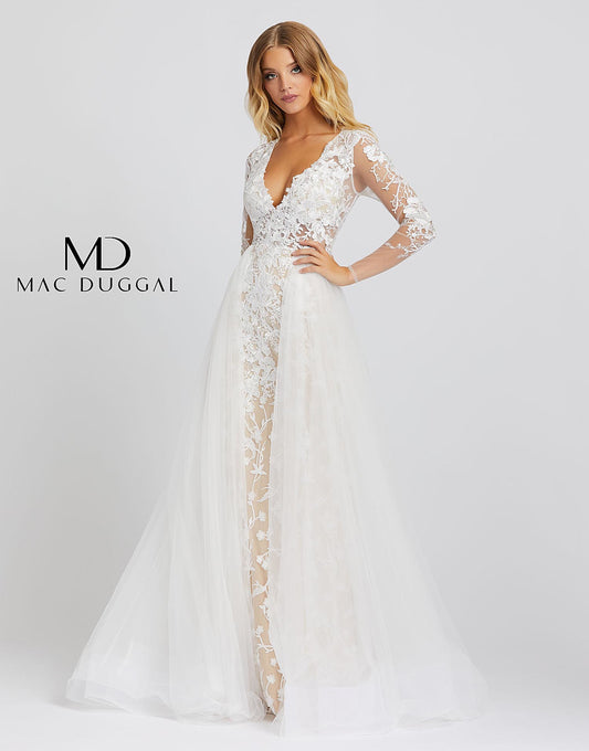 26322M is an ivory nude ball gown with sheer long sleeves, a v-neckline, and overskirt. This incredible gown has embroidery detailing from head to toe. This Mac Duggal Prom Collection 26322M ivory nude formal gown has a fitted silhouette in embroidered tulle, with a deep V-neckline and illusion long sleeves. The illusion bodice is offset with a fully lined skirt, finished with a gathered overskirt that cascades to a court train. Great wedding reception dress or bridal gown. Prom, Bridal, Pageant
