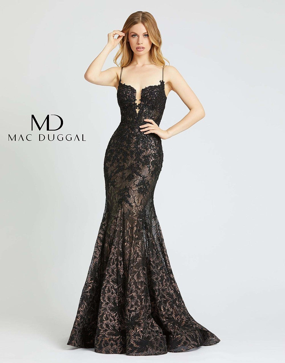 Mac Duggal 79252M - 79252 Have heads turning right when you put on this chic dress! Style 79252M is a mermaid lace gown with spaghetti straps and a v-neckline. This black gown is the perfect combination of sexy & sweet. This Mac Duggal Prom Collection 79252M black prom gown is styled in metallic lace, featuring a corset bodice with a deep-notched neckline and spaghetti straps. This semi-trumpet dress is completed with soft godets that spill to a horsehair hem and court train. Prom, Pageant, Sexy. Plunging n