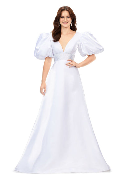 Ashley Lauren 11378 This elegant a-line gown features a heat set detailed waistband and oversized puff sleeves. With a v-neckline and v-back, this gown is the perfect mesh of elegant and fun! V-Neckline Oversized Puff Sleeves A-Line Skirt Shimmer Satin COLORS: Black, Red, White