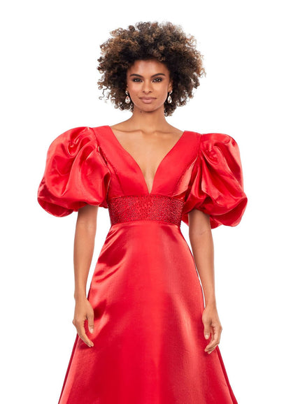 Ashley Lauren 11378 This elegant a-line gown features a heat set detailed waistband and oversized puff sleeves. With a v-neckline and v-back, this gown is the perfect mesh of elegant and fun! V-Neckline Oversized Puff Sleeves A-Line Skirt Shimmer Satin COLORS: Black, Red, White