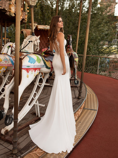 Pronovias White One Bridal OKAPI  Sensuality at its most feminine was the inspiration for this amazing wedding dress with a mermaid silhouette. A design that uses the most suggestive necklines and details to create a sweetly stunning silhouette: