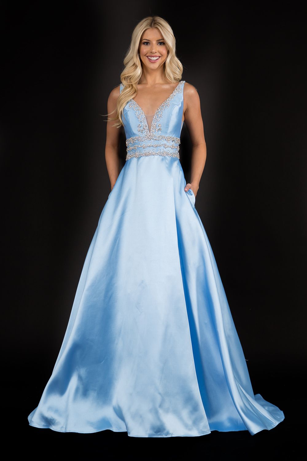Nina Canacci 2290 Embellished plunging neckline A line prom dress embellished evening gown.  Three rows of embellishments around the waistline.  Colors:  Baby Blue, Ivory, Royal   Sizes:  8,10,12,14,16,18,20,22,24,
