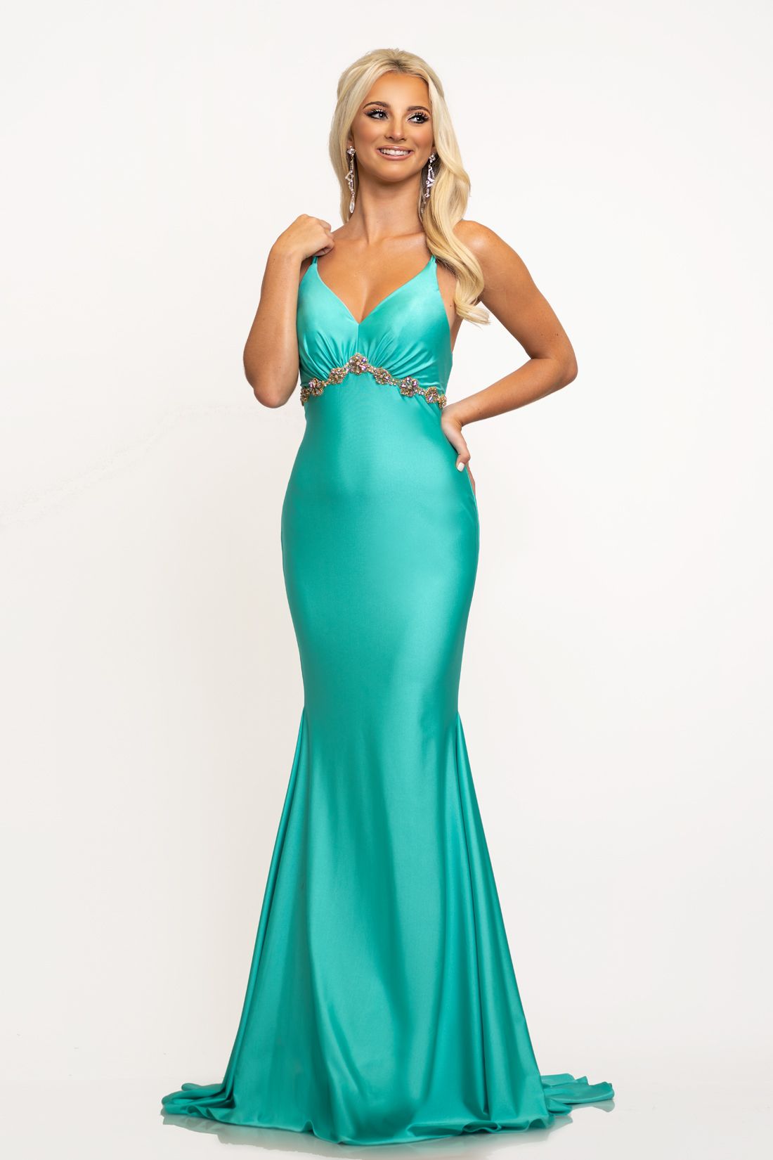 Johnathan Kayne 2210 This is a v neckline open back fitted stretch lyrca prom dress with a high waistline trimmed in embellishments.  The pageant gown is open in the back and the double spaghetti straps cross several times in the back and the long mermaid skirt flows into a sweeping train. A very nice smooth evening gown.  Colors Navy, Seafoam   Sizes 00, 0, 2, 4, 6, 8, 10, 12, 14, 16 