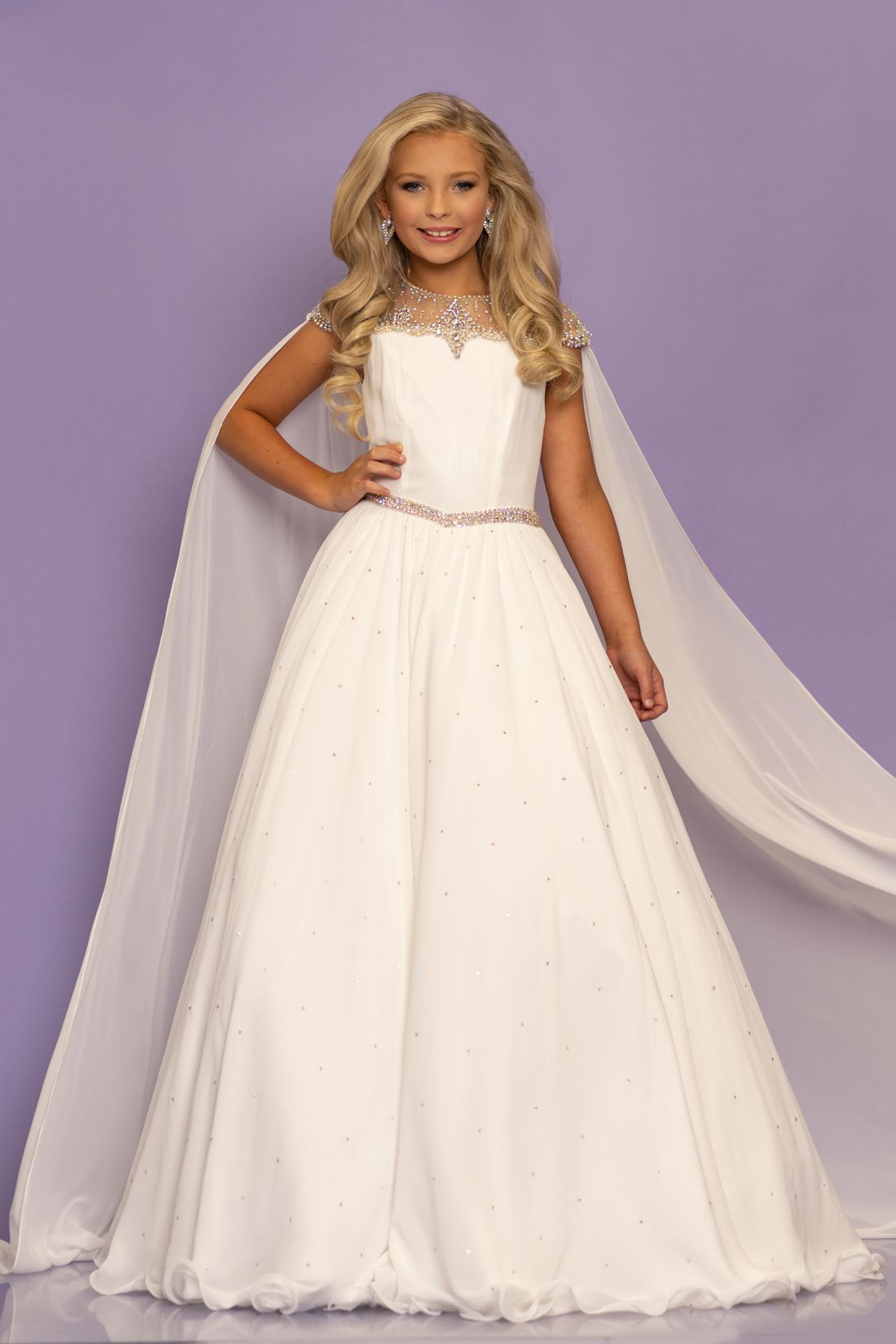 Sugar Kayne C136 by Johnathan Kayne is a girls and preteen pageant dress of flowy chiffon with a sheer embellished cap sleeve flowy chiffon cape.  This dress has an embellished waistline.   Available colors:  Neon Pink, White  Available sizes:  2, 4, 6, 8, 10, 12, 14, 16 