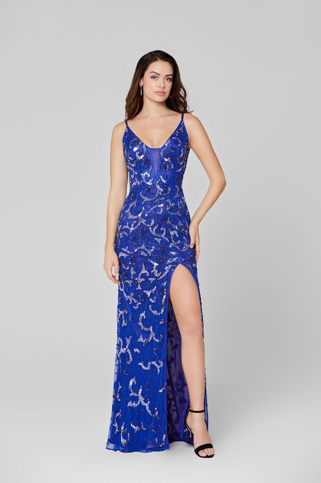 Primavera Couture 3450 Plunging V neckline with mesh panel sequin beaded evening gown.  Embellished Sequin Beaded Fitted Prom Dress Slit Formal evening gown. Open Back, Backless Form Fitted Silhouette.  Available colors:  Royal Blue  Sizes:  2