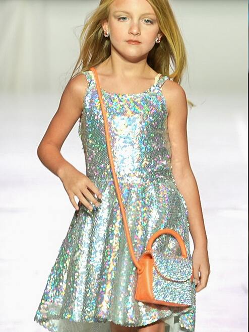 Marc Defang 5013 Short Sequin Fun Fashion Girls Pageant Dress Interview   Fun fashion, opening number dress Holographic sequins material  fully beaded Asymmetrical cut hems  Center back invisible zipper Fully lined dress Available Sizes: 8  Available Colors: Silver