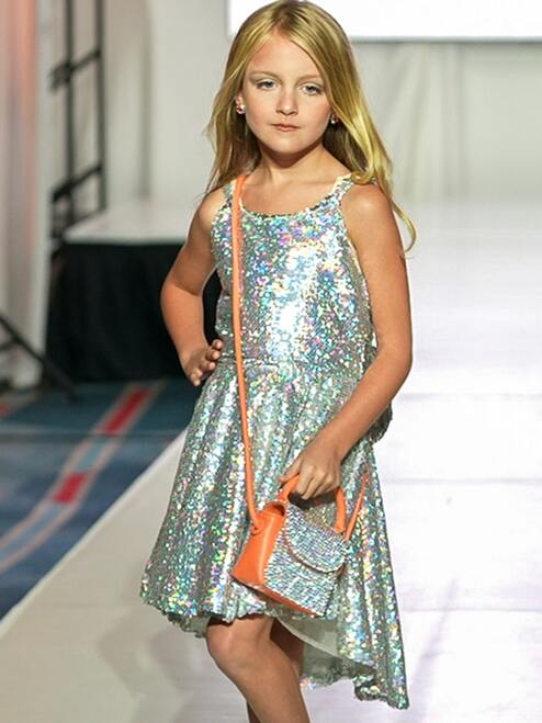 Marc Defang 5013 Short Sequin Fun Fashion Girls Pageant Dress Interview   Fun fashion, opening number dress Holographic sequins material  fully beaded Asymmetrical cut hems  Center back invisible zipper Fully lined dress Available Sizes: 4-14  Available Colors: Hot Pink, Silver