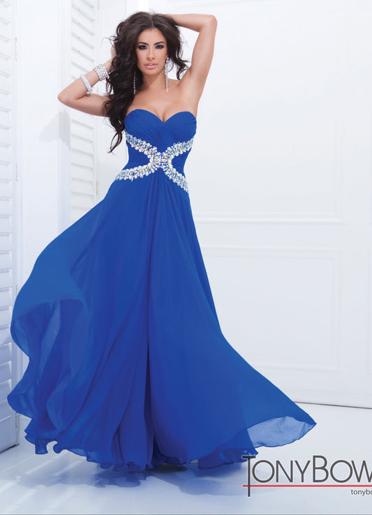 Tony Bowls 11412 Available in Royal Blue size 0   ﻿Stunning Long Chiffon Prom Dress with crystal accents along the waist leading to a flowing skirt. Makes an excellent pageant gown. 